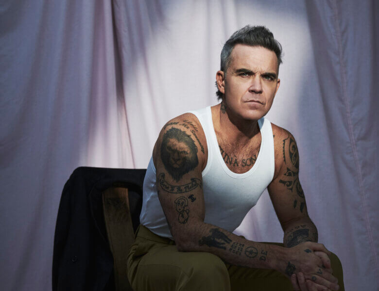 Robbie Williams . „Spies“ (Single + Audio Video)